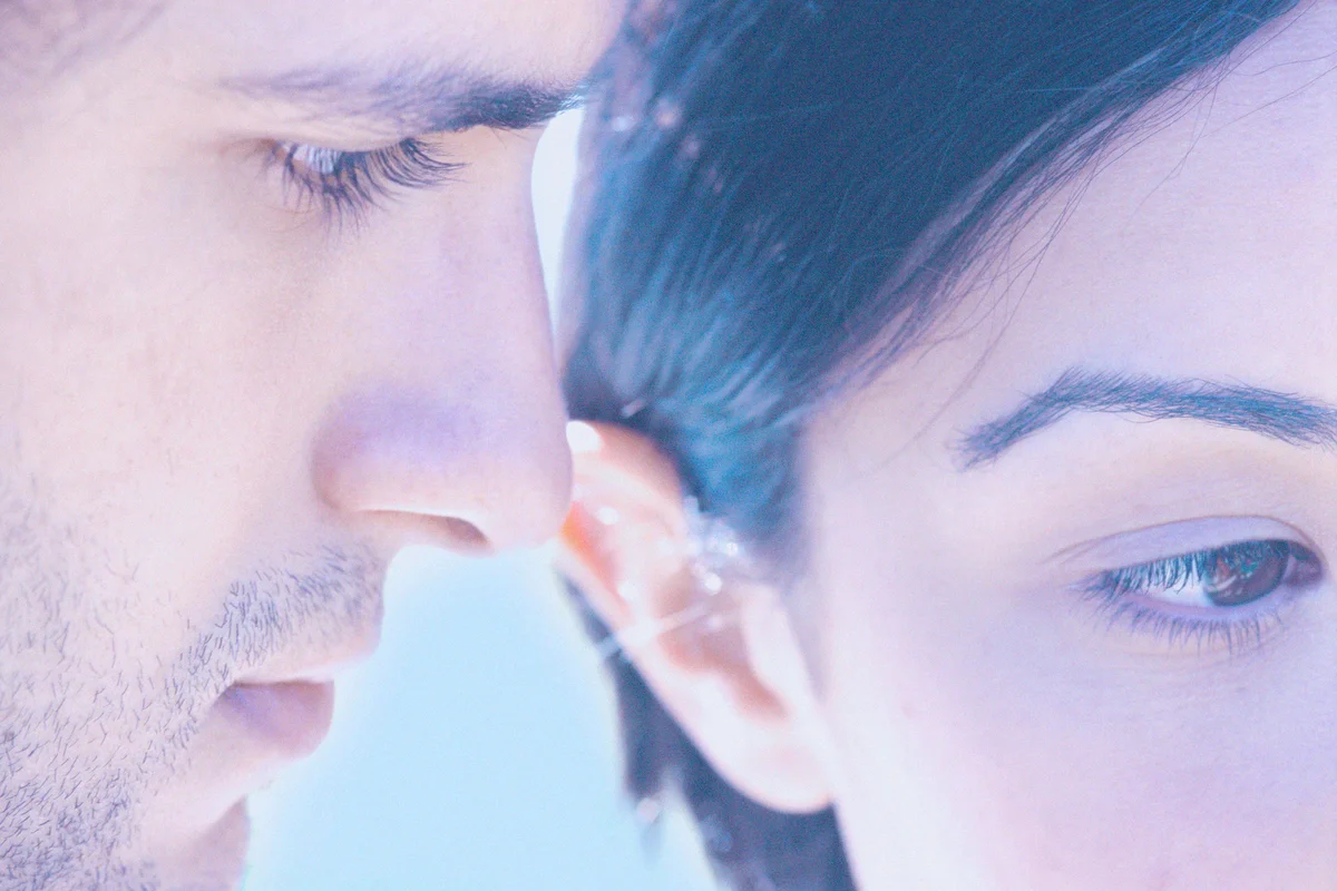 Man and woman with faces next to each other