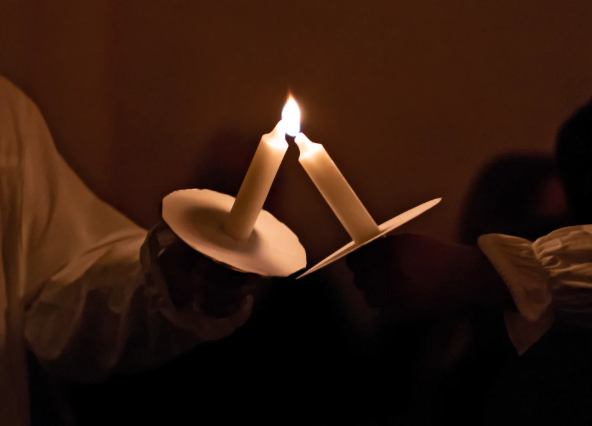 Lighting candles in church