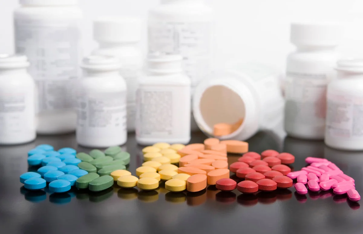 rainbow of prescription drugs with bottles