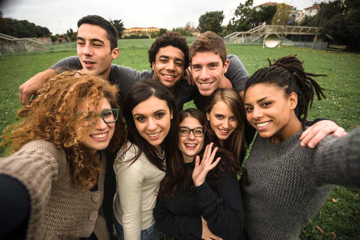 friends take a selfie at the park