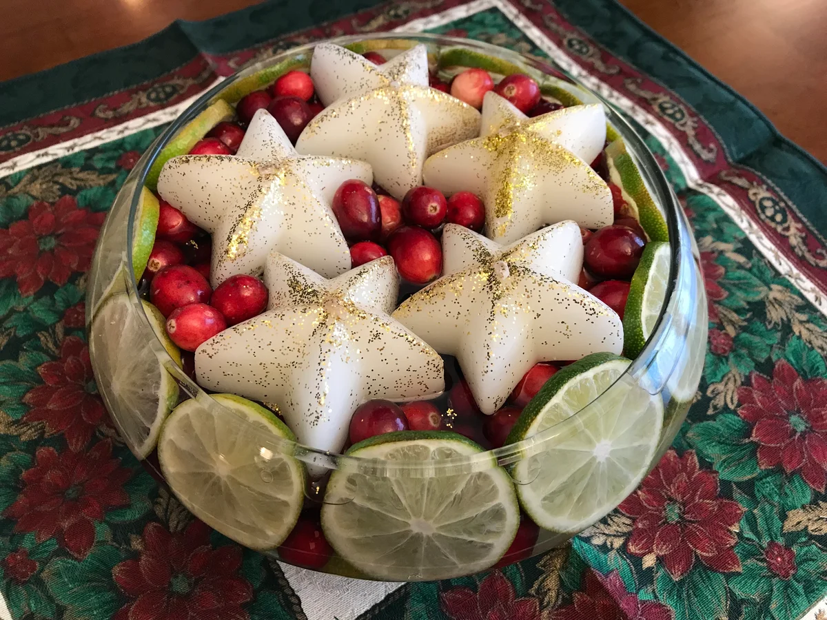 Holiday centerpiece cranberries, limes & star candles