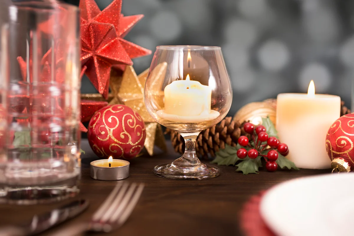 Dining table place setting with Christmas holiday decorations