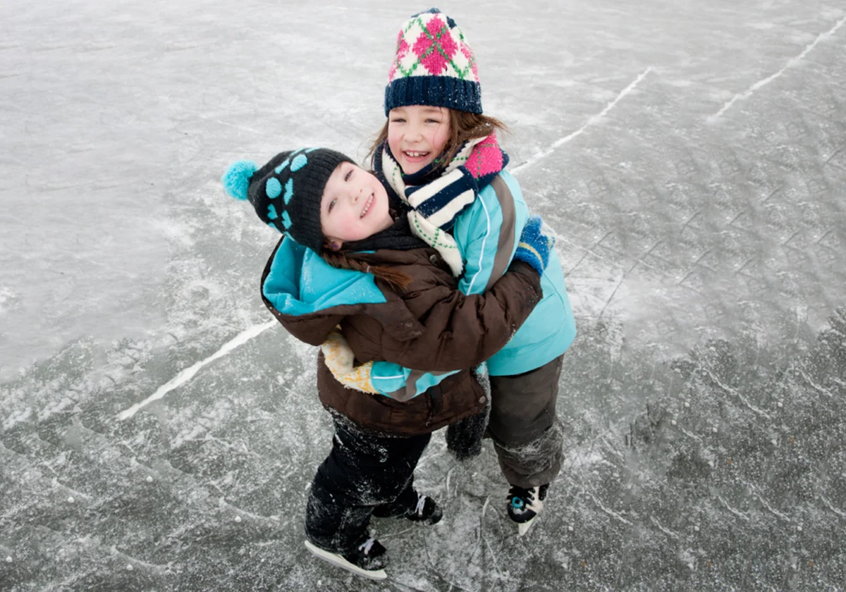 Two girls ice skating