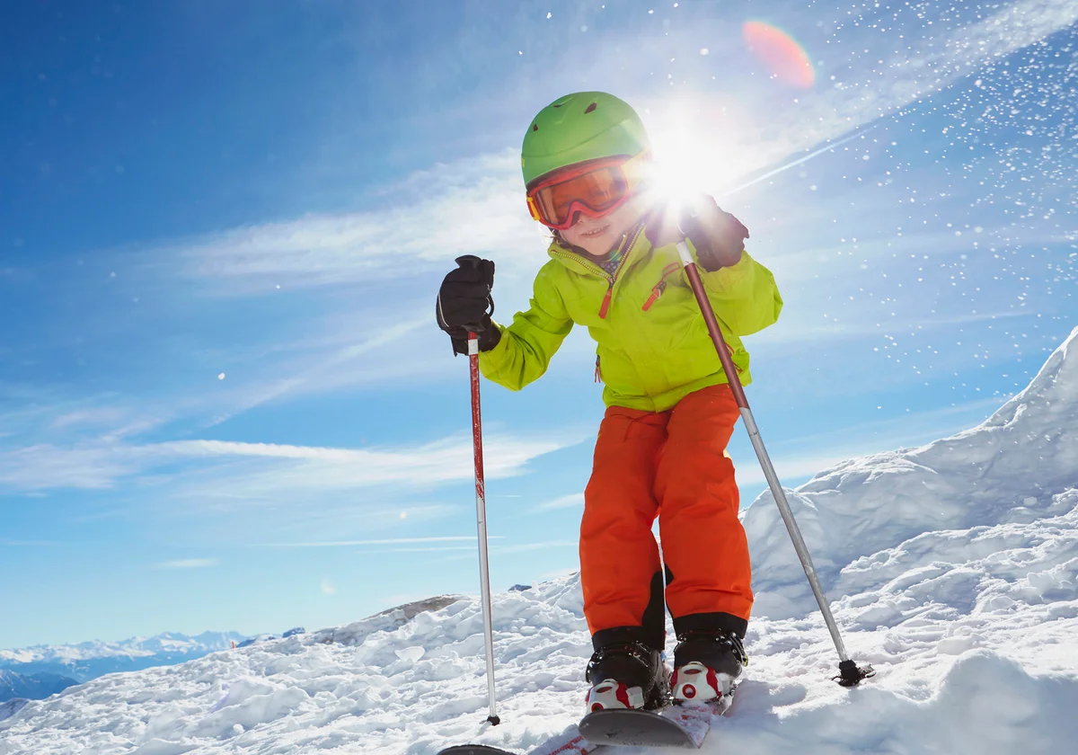 Young boy skiing downhill