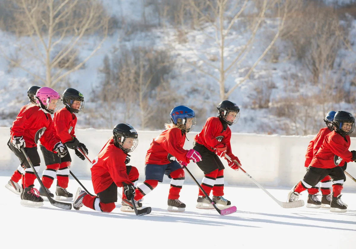 Ice hockey team skating on outdoor rink