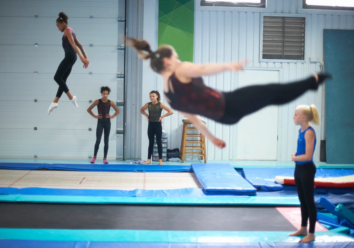Young gymnasts practising move