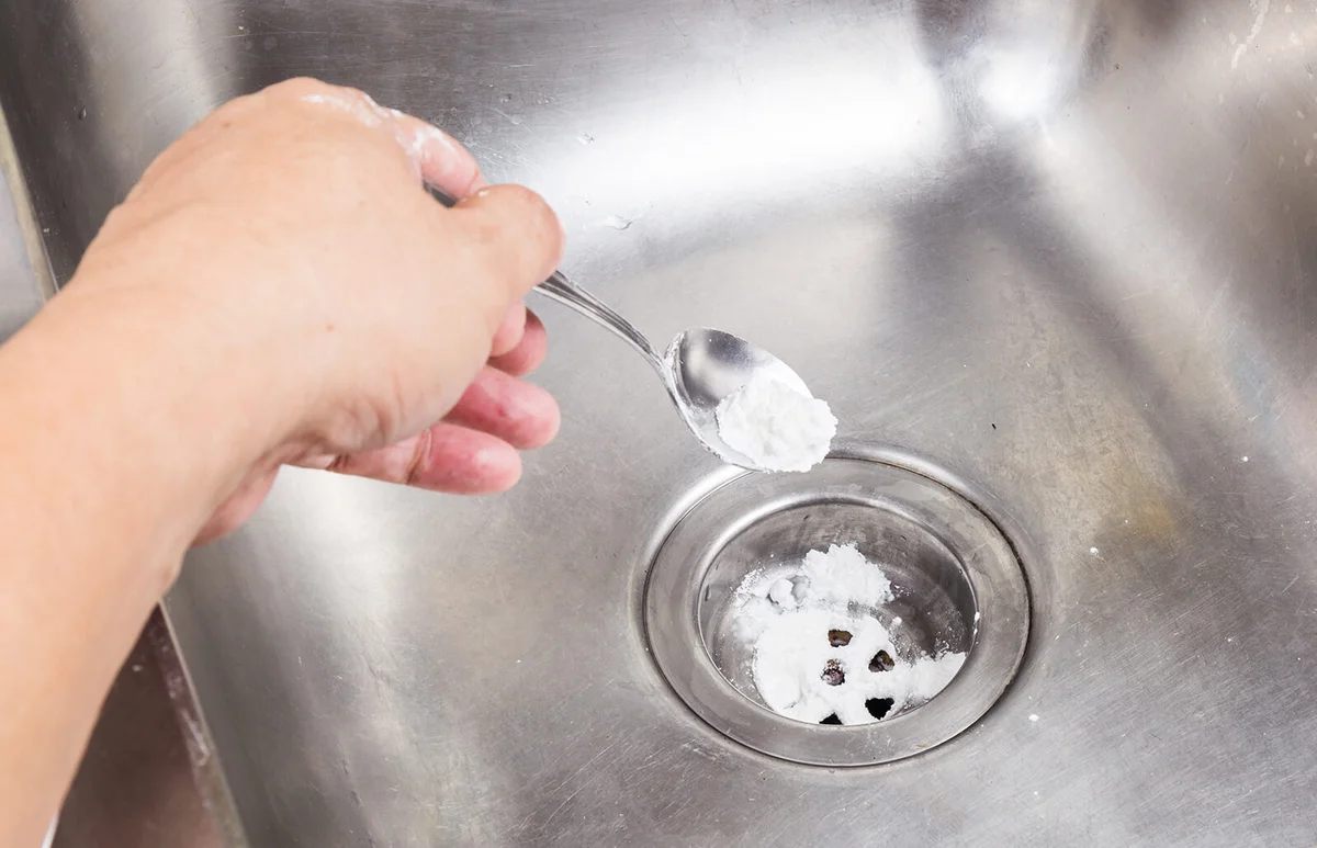 Baking soda poured to unclog drainage system at home