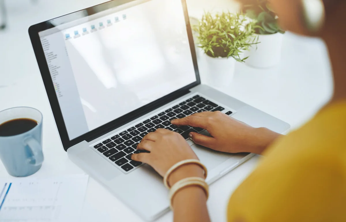 Woman working on a laptop in an office