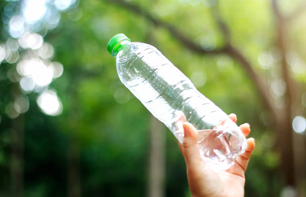 Hand holding an plastic bottle