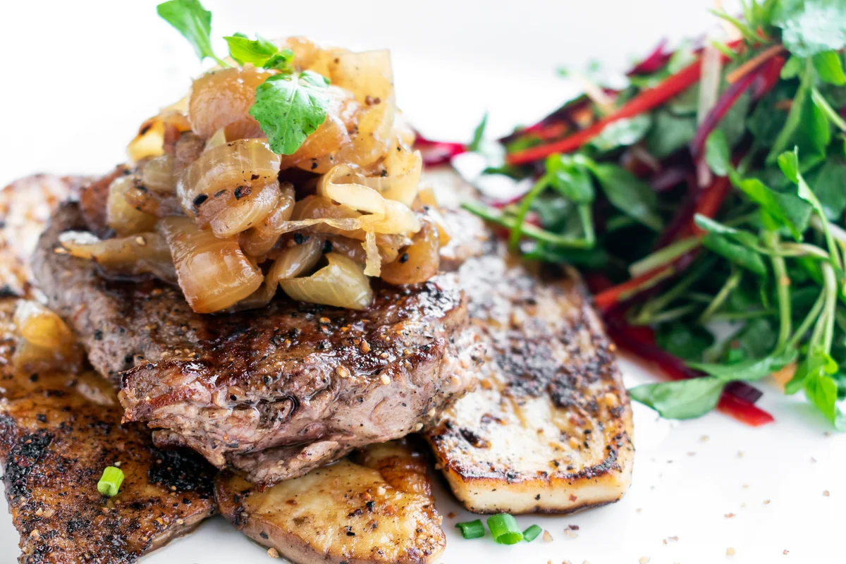 Steak with bourbon caramelized onions