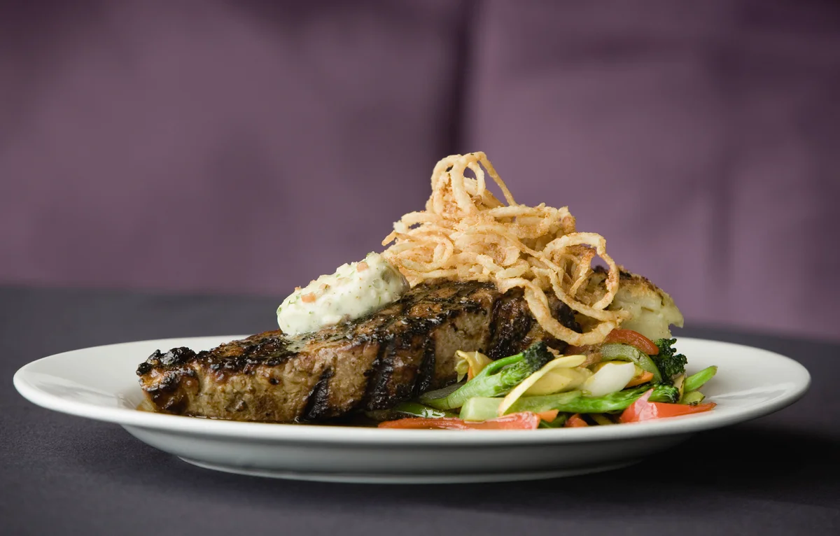 Steak with crispy shallots and blue cheese butter