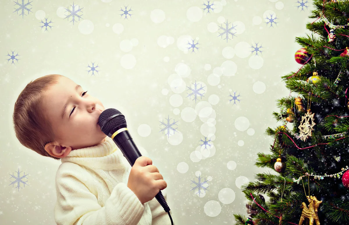 Child sings into a microphone on the New Year