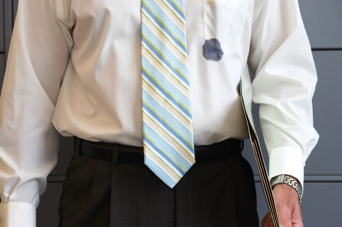 Ink stain on man's shirt