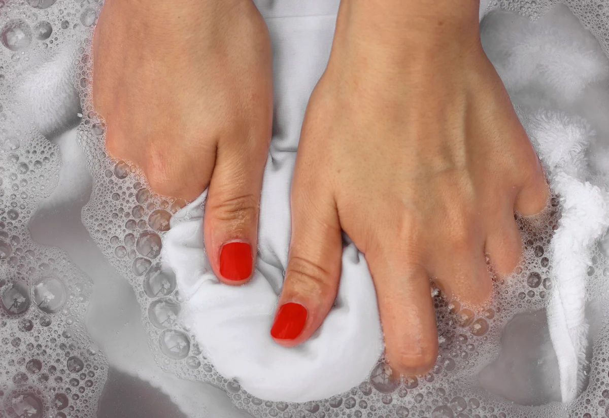 Soaking shirt in soapy water
