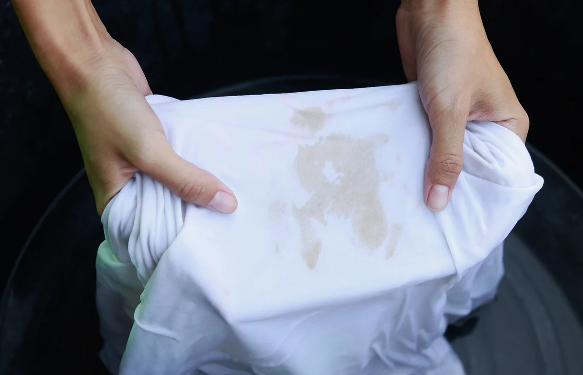 Cropped Hands Of Woman Washing Stained T-Shirt