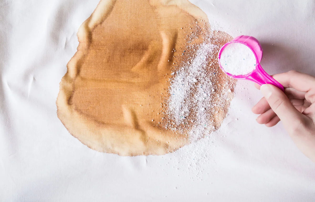 brown coffee stain on light t-shirt
