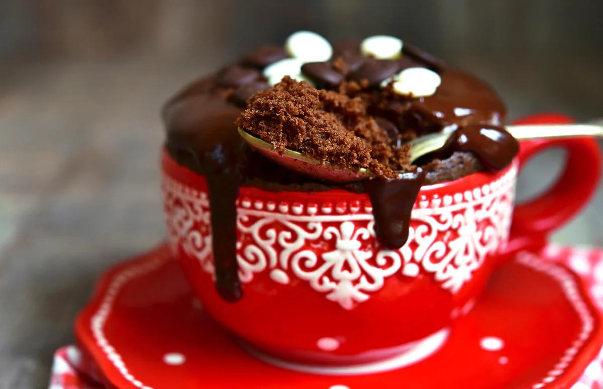Chocolate mug cake decorated with chocolate glaze