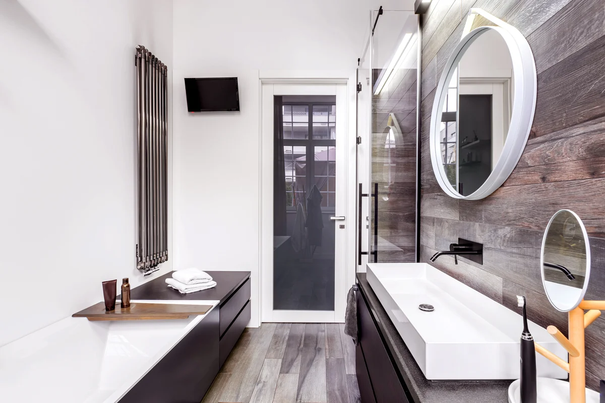 Small, bright bathroom in modern design with wooden style tiles
