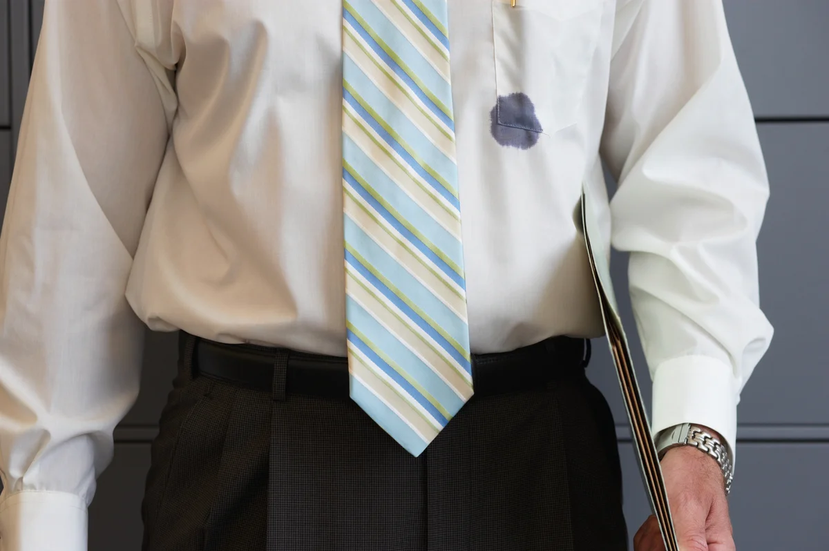 Businessman with an ink stained shirt