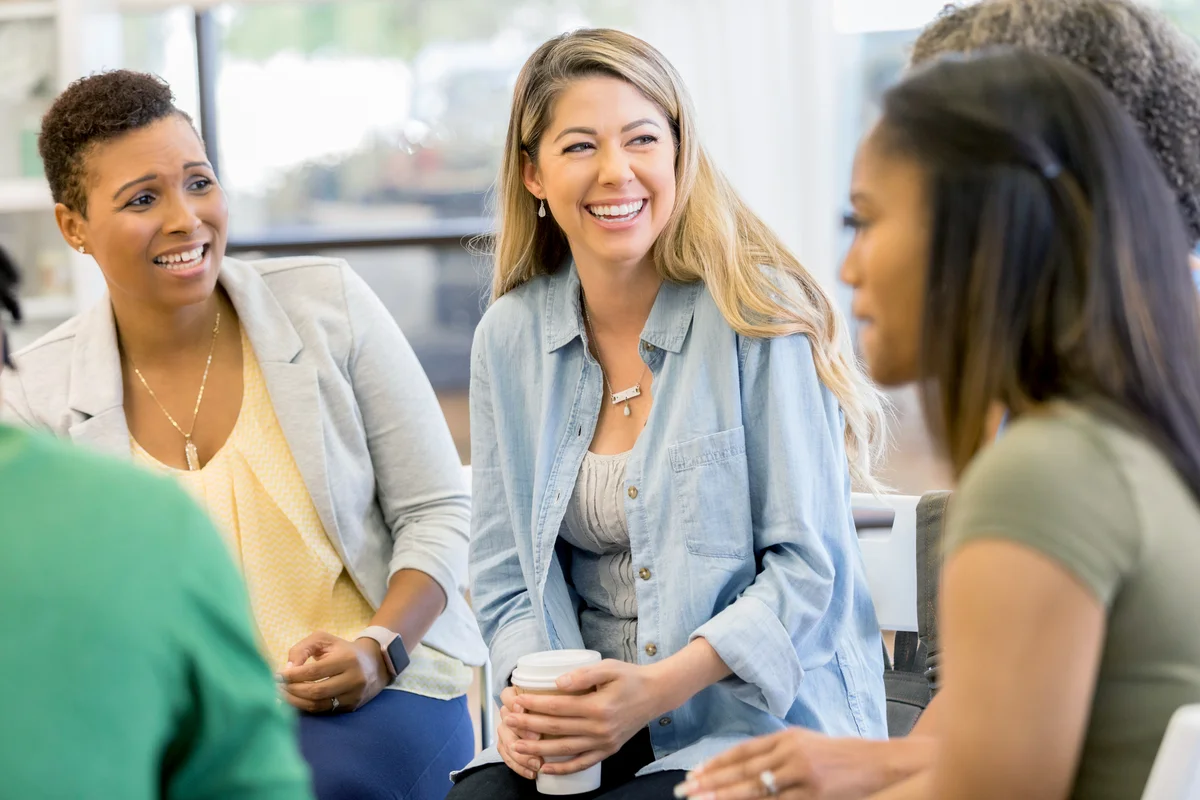 Mid adult woman talks about something during a support group
