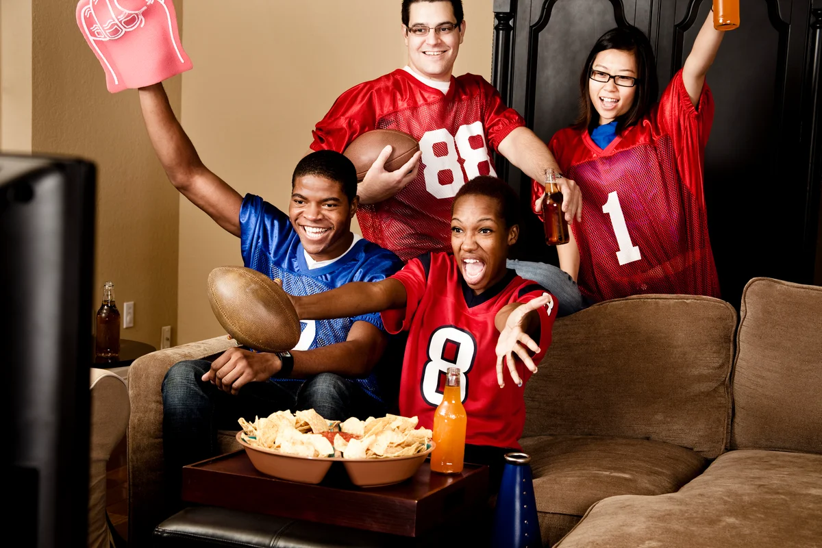 Football fans at home watching the game