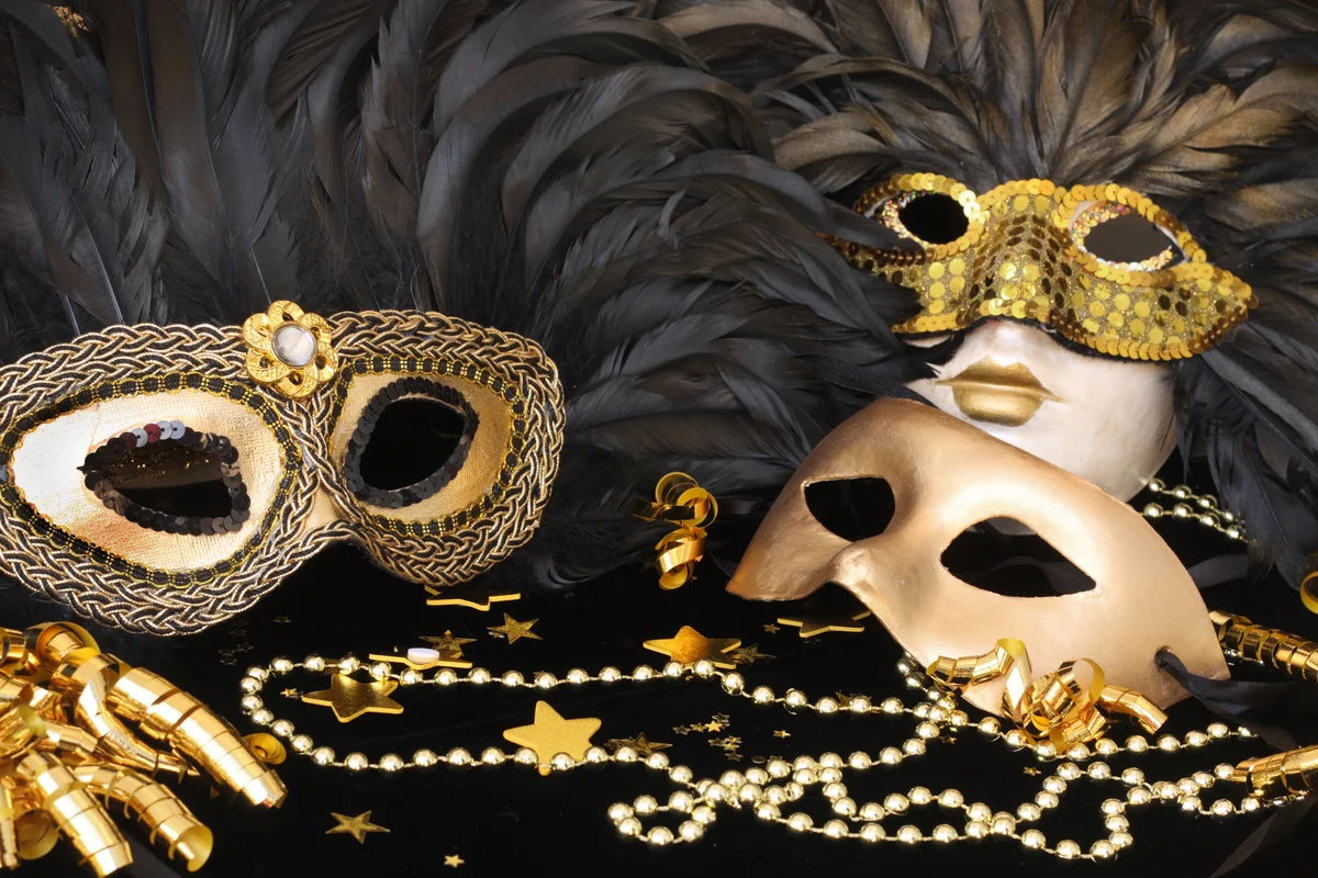 golden mardi gras masks with feathers