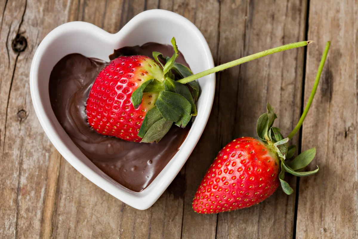 Dipping Strawberry In Melted Chocolate
