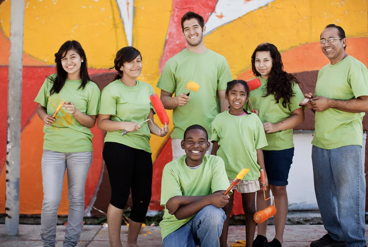 Volunteers painting wall