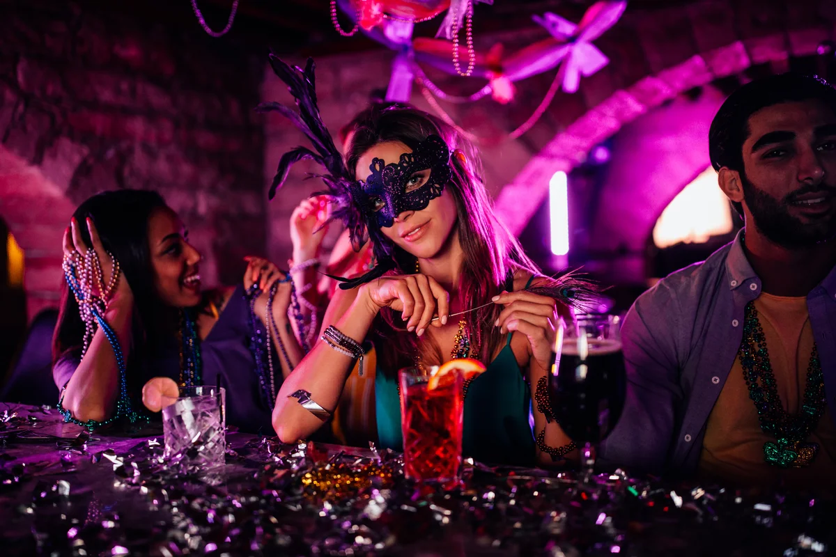 woman with mask at Mardi Gras night club party