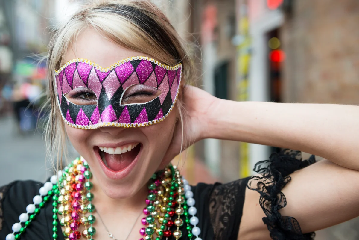 Woman wearing a Mardi Gras mask