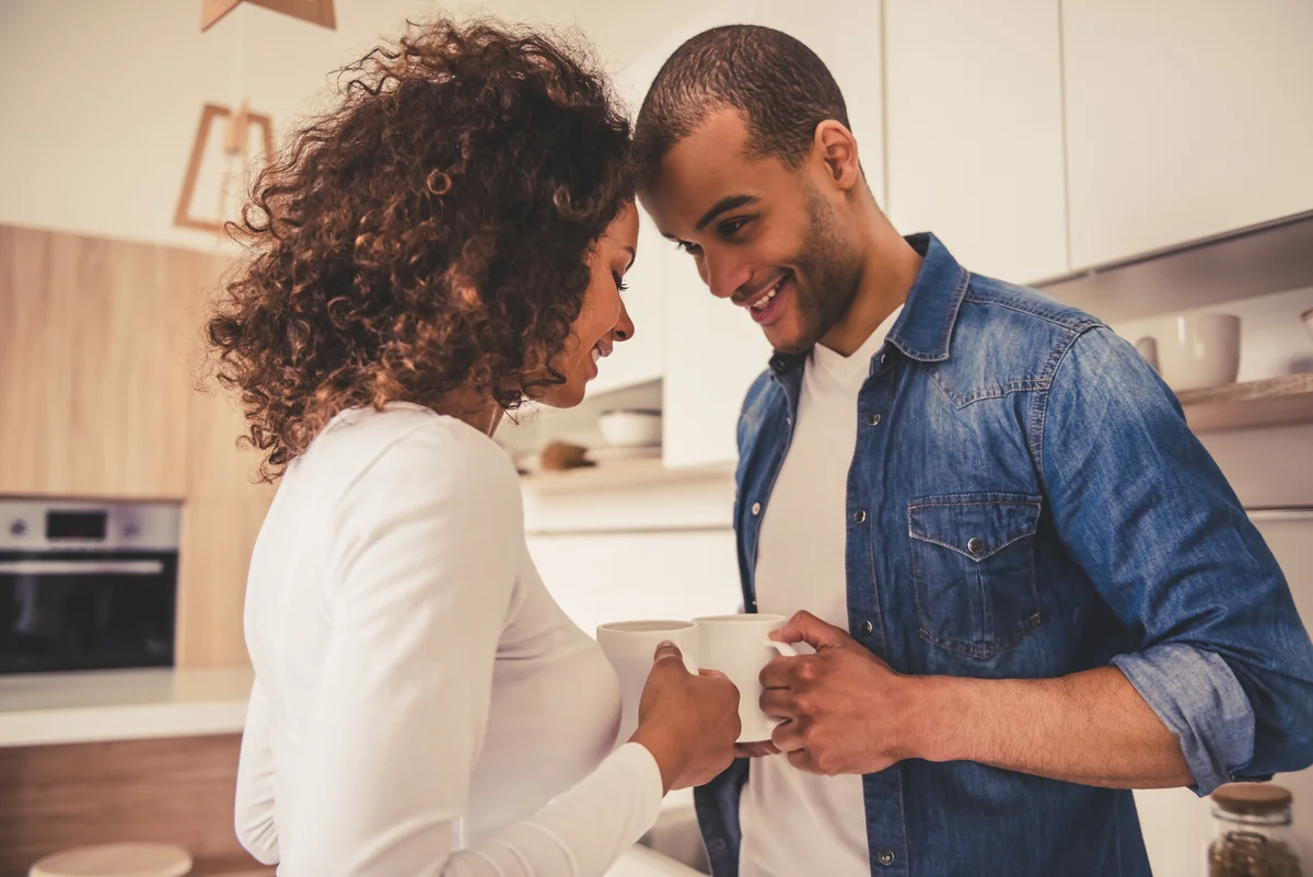 couple with coffee in kitchen