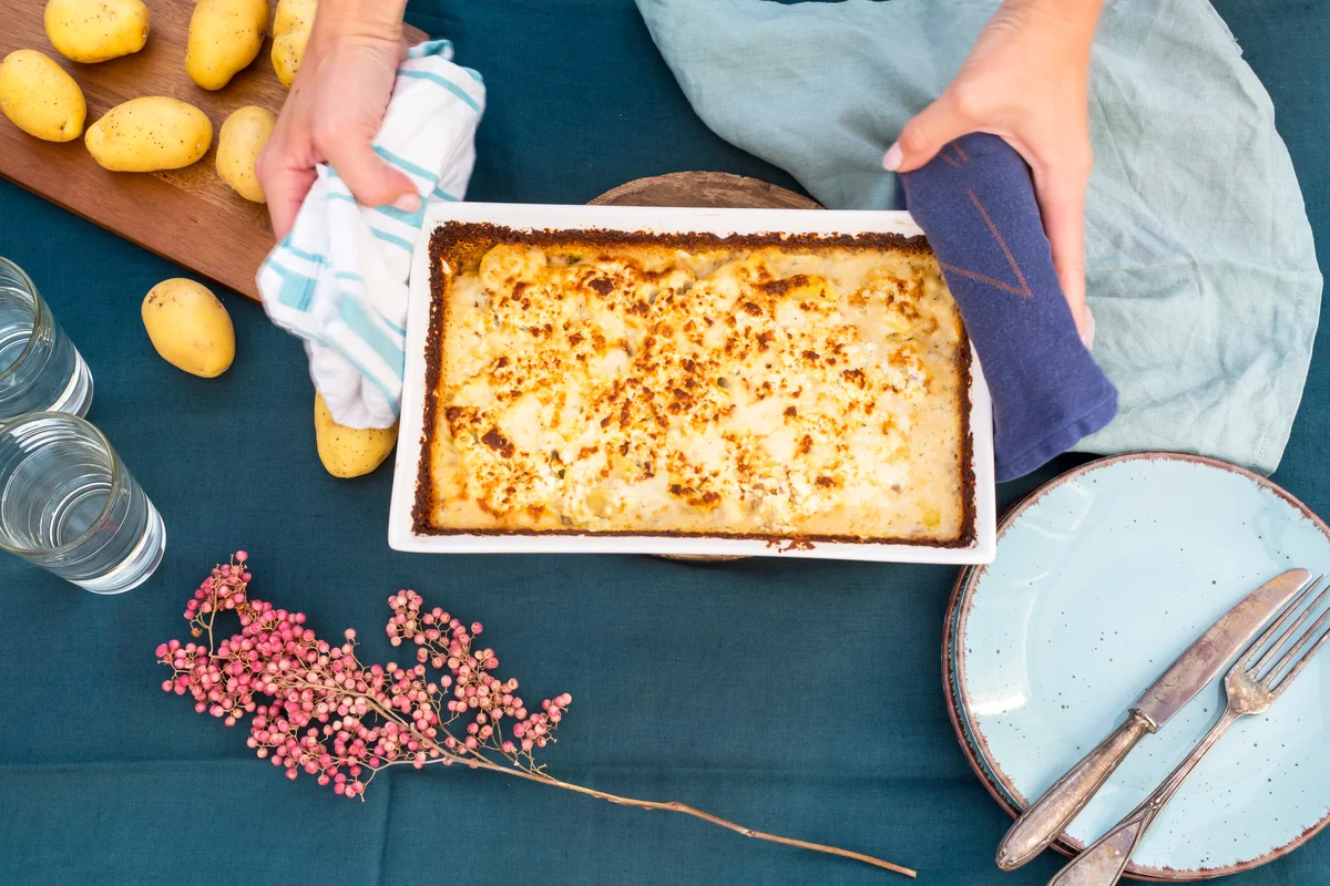Woman serving turkey casserole
