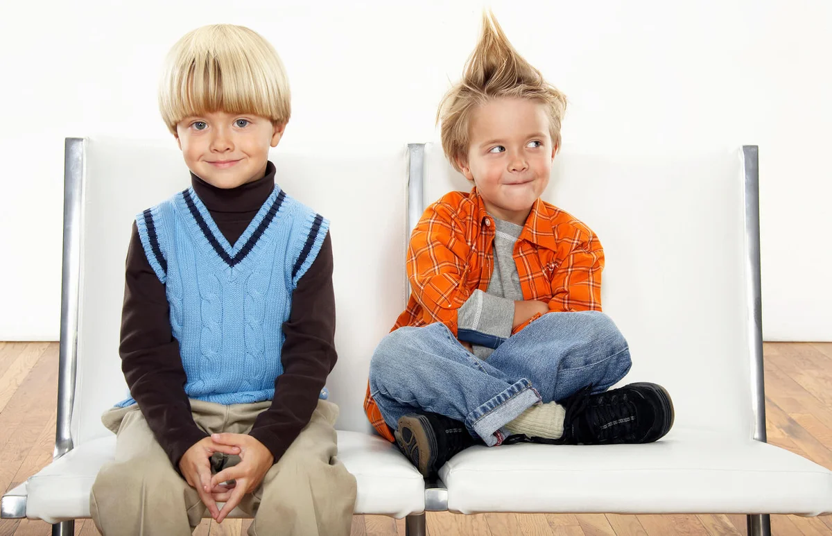 Twin boys wearing formal and casual attire
