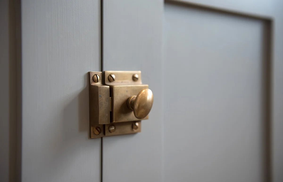 kitchen door catch on a grey fitted cabinets