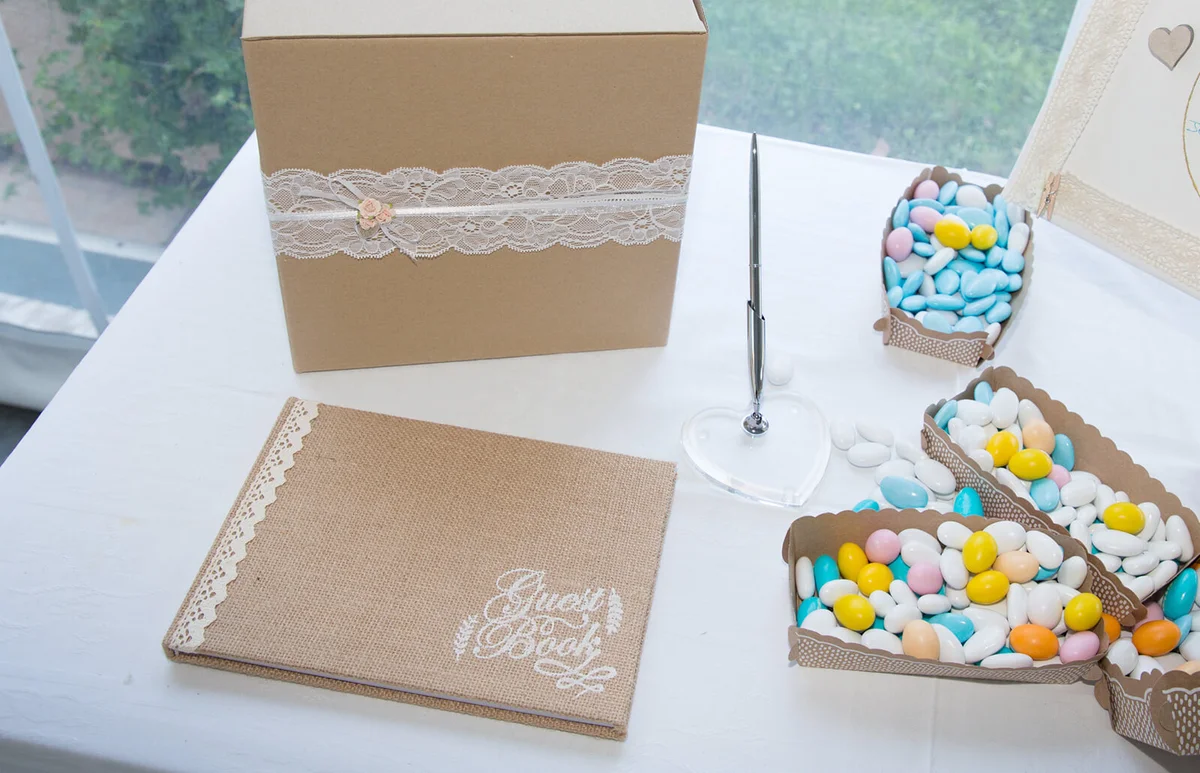 wedding table of the newlyweds with the dragees and the guestbook