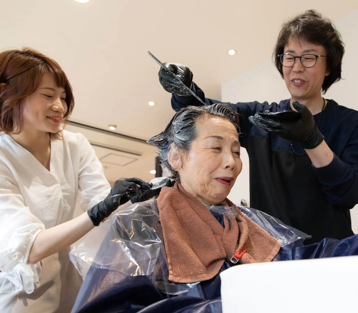 Japanese senior woman having beauty treatment