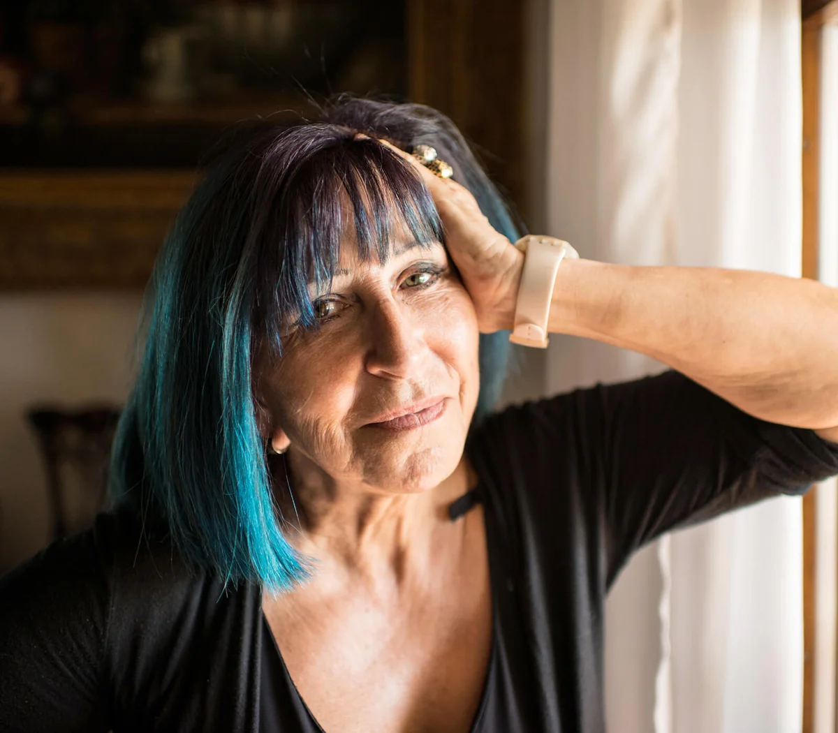 Senior woman with blue-dyed hair