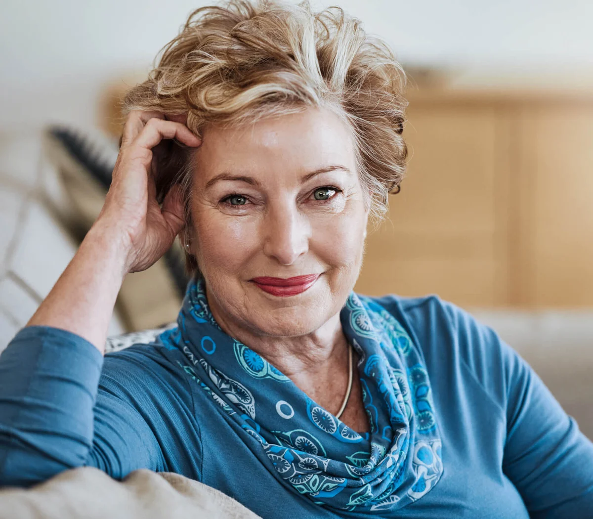 Portrait of an attractive senior woman relaxing on the sofa at home