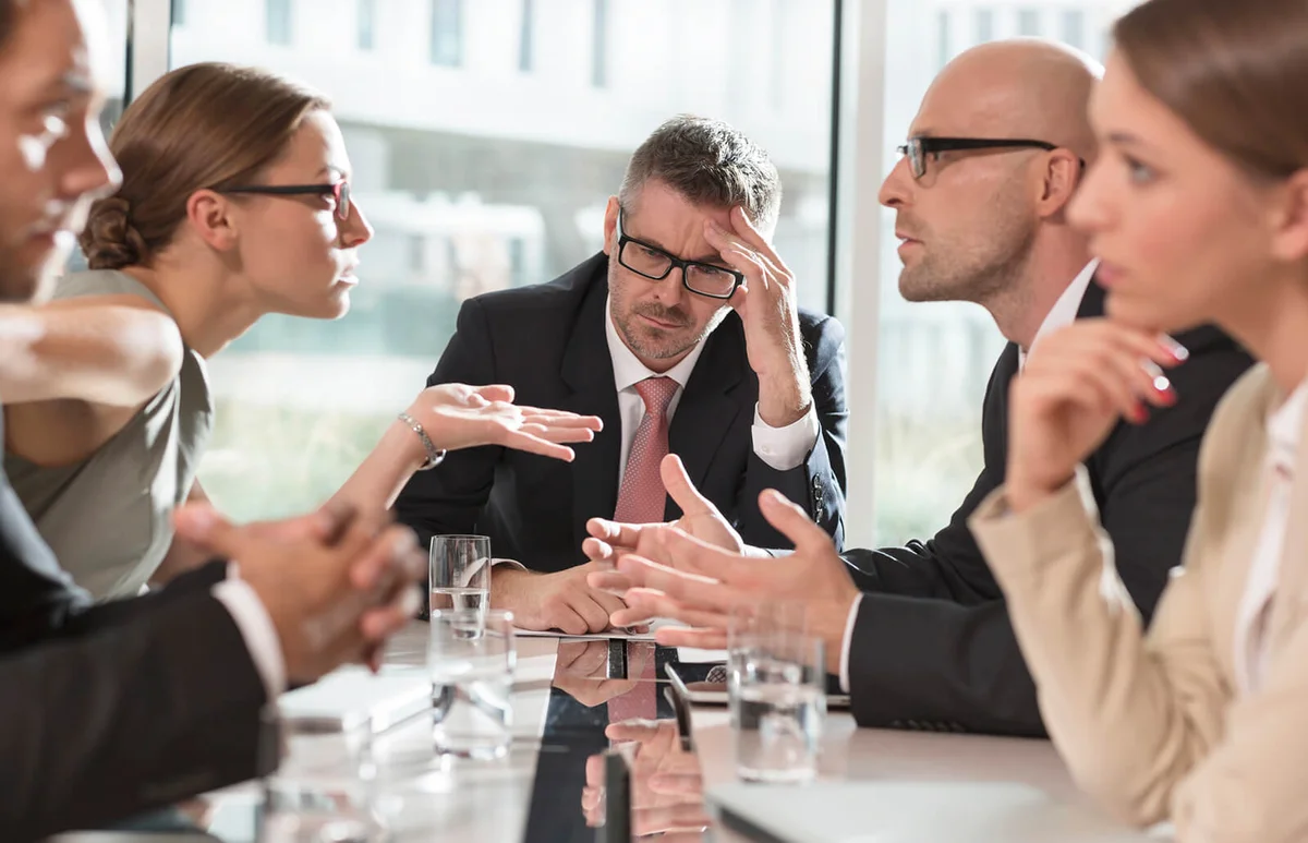 Five business people having an argument