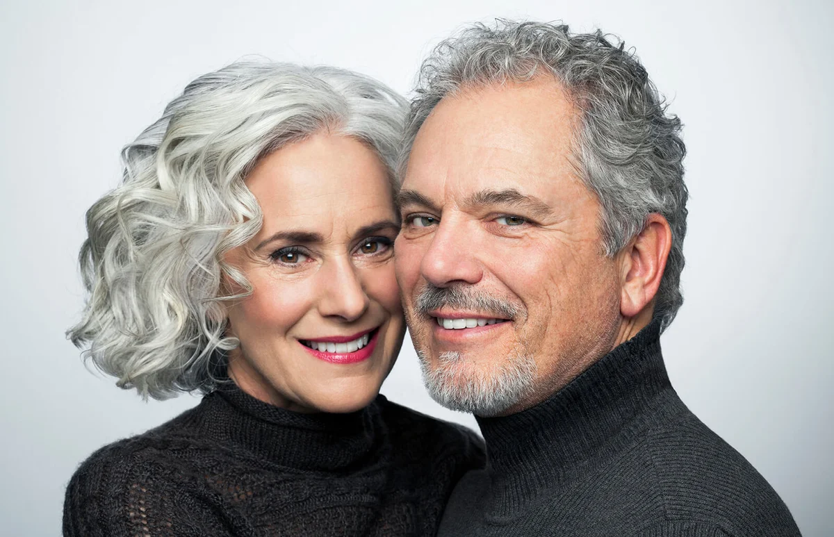 Mature couple smiling for camera