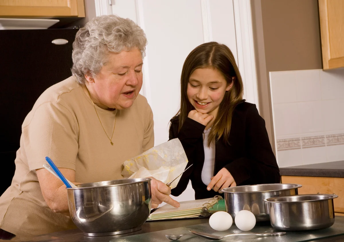 Grandmother and granddaughter cooking together