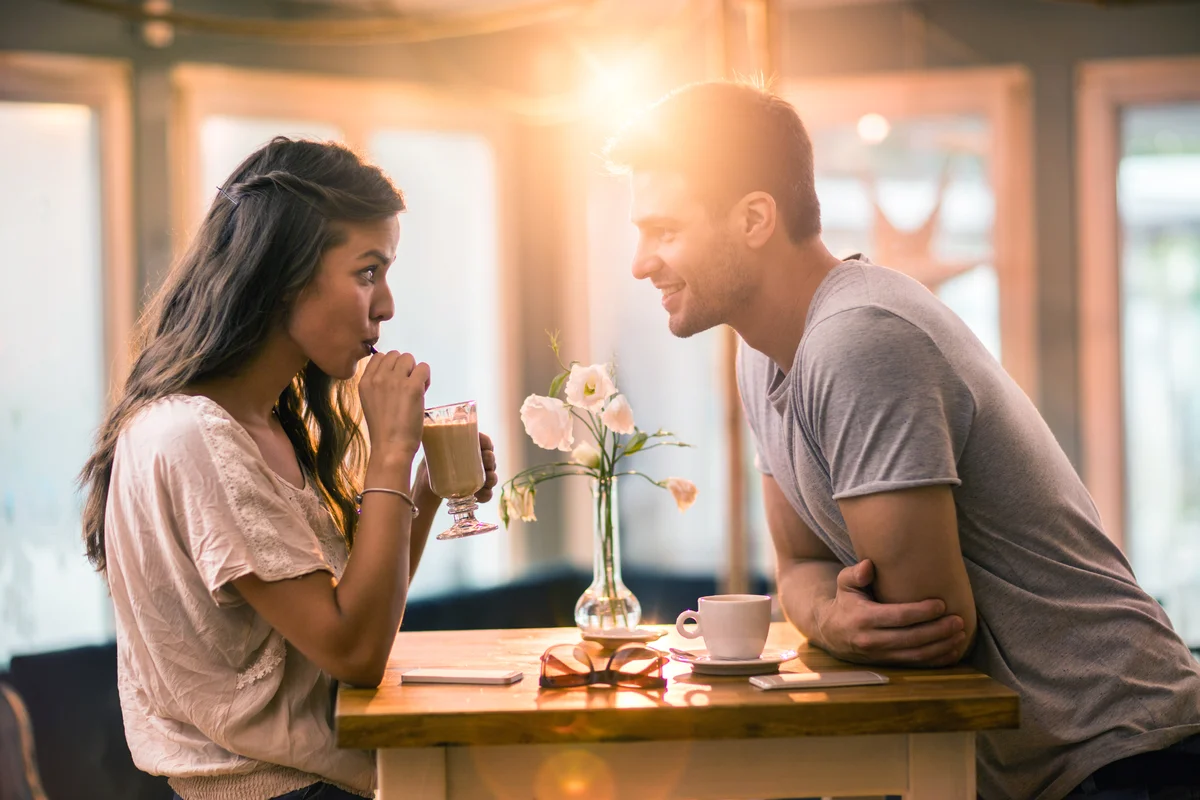 Young couple in love spending time together in a cafe