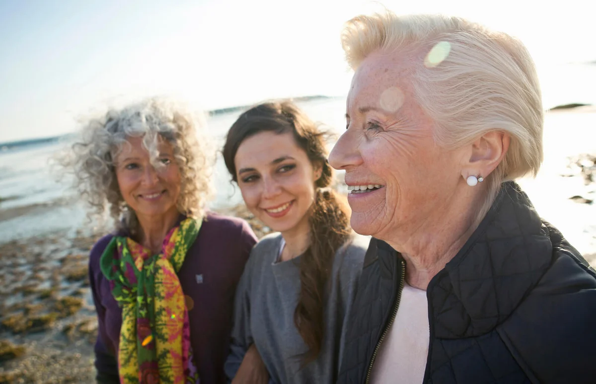 Female family members chatting on beach