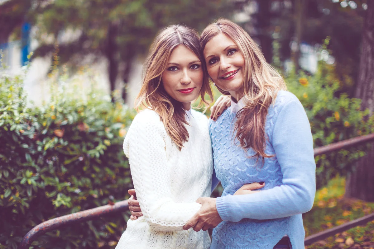 Outdoors portrait of a mother and her daughter