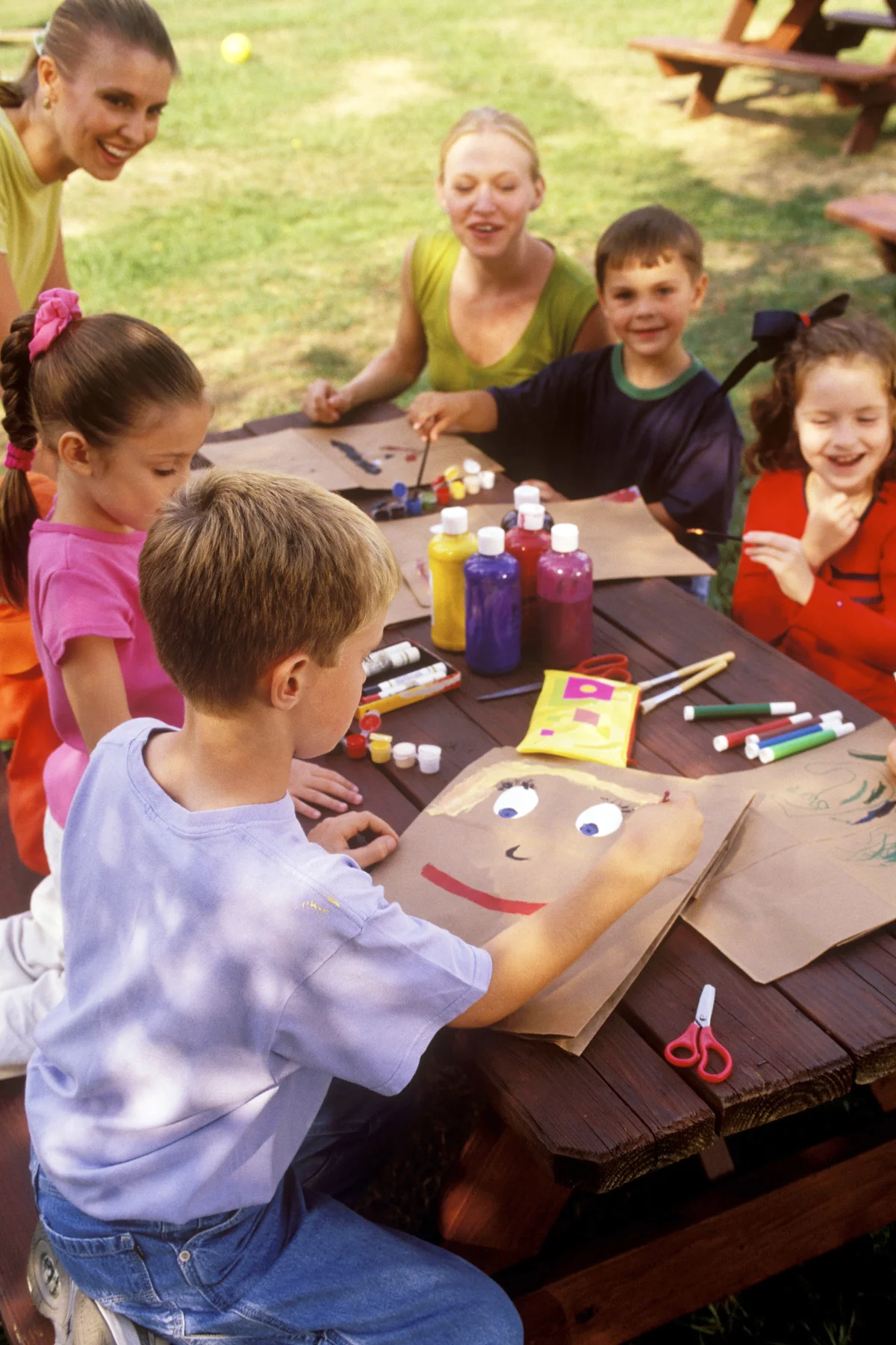 Daycare Students Having Arts and Crafts in a Park