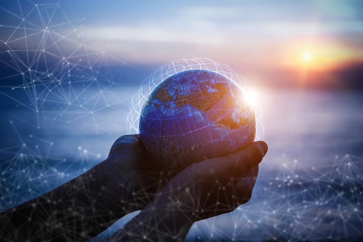 Small Hands holding the world with global connection