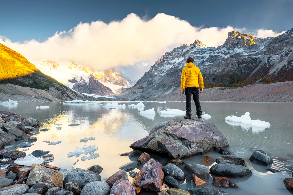 Man looking at view at sunrise in Los Glaciers national park