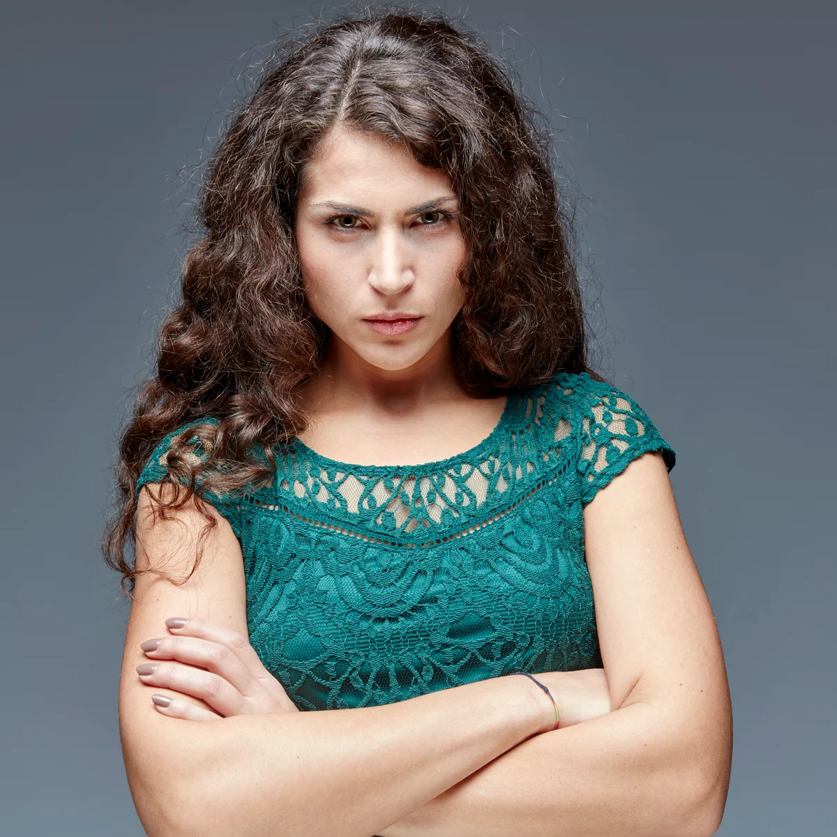 Angry young woman with crossed arms