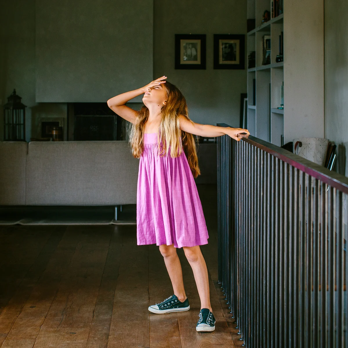Girl with hand on forehead