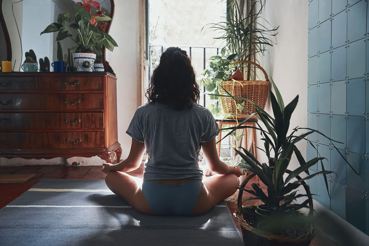 Woman meditating at home